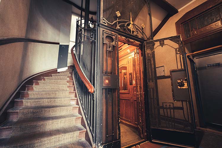 Photo of an old elevator with a mirror
