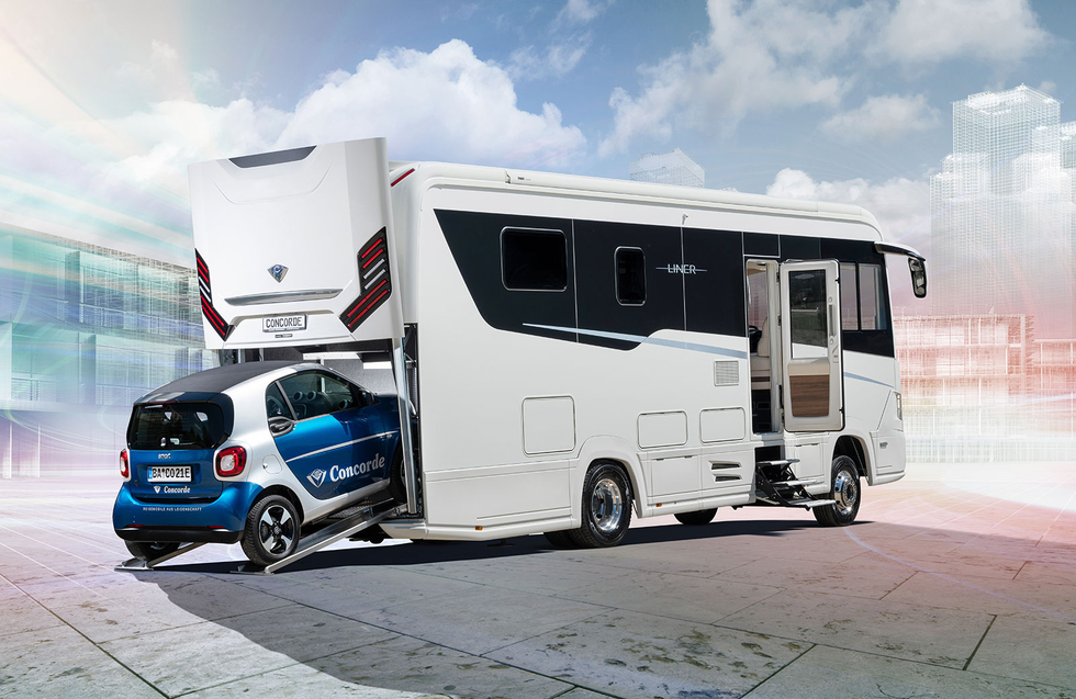 An RV with built-in car garage